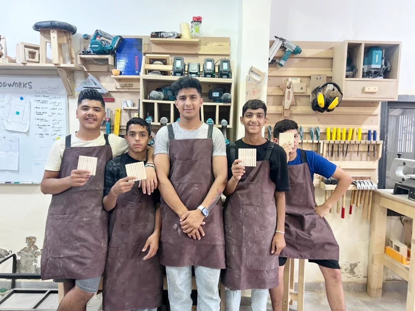 Hassan and carpentry trainees, featured by Tahaddi Lebanon